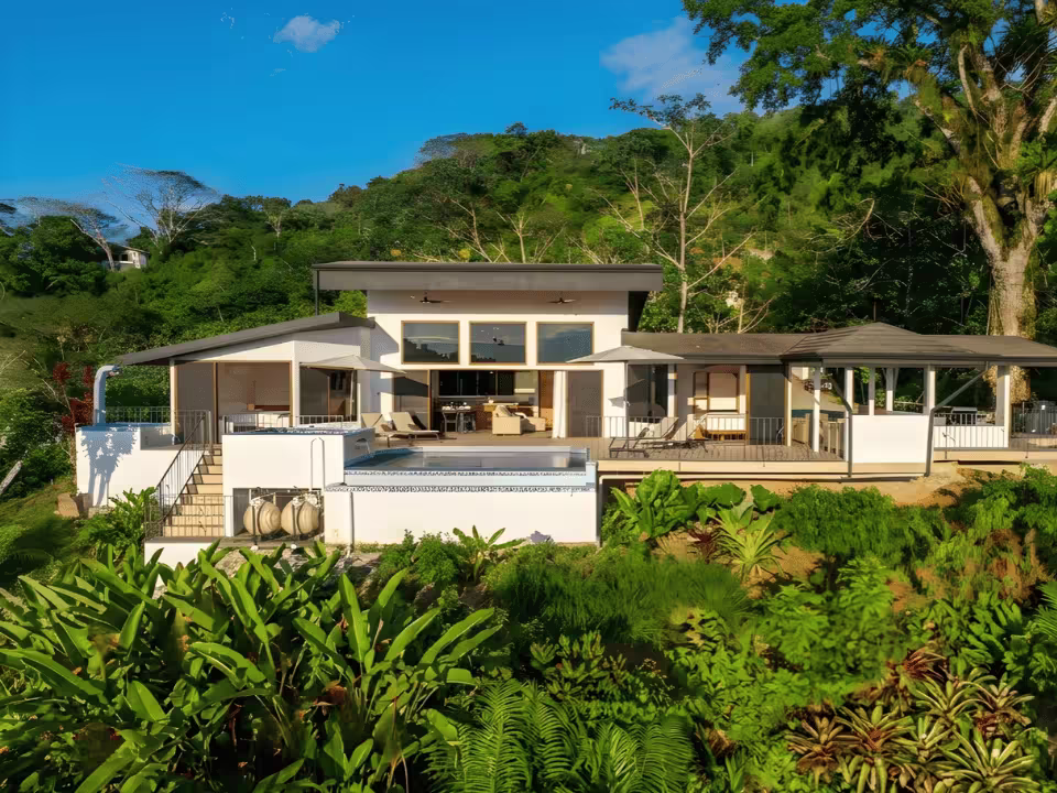 Aerial view of KsaLinda luxury vacation rental with private pool surrounded by jungle in Savegre, Costa Rica