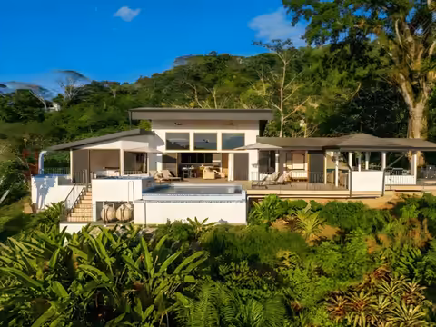 Aerial view of KsaLinda luxury vacation rental with private pool surrounded by jungle in Savegre, Costa Rica